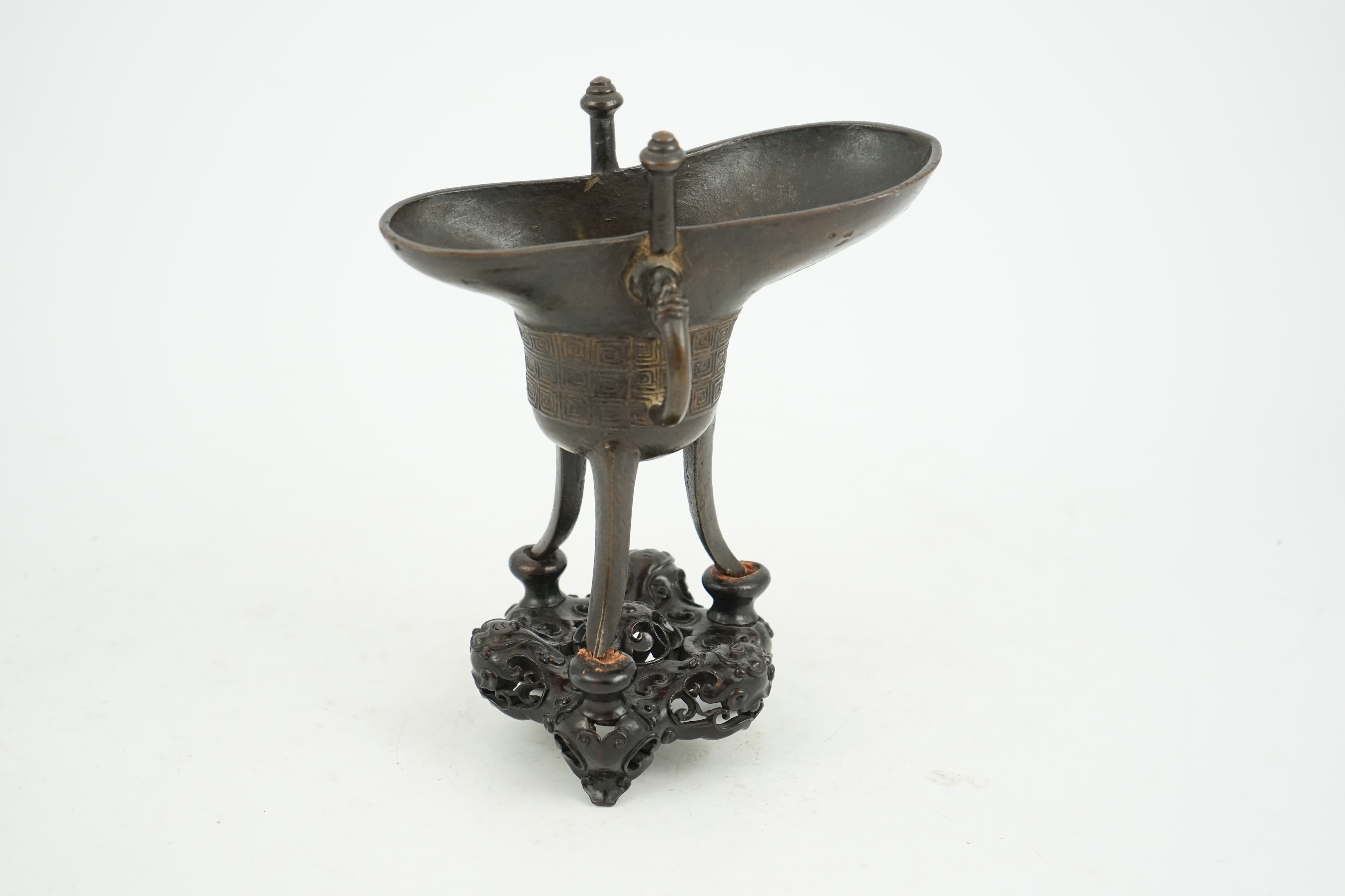 A good Chinese archaistic bronze tripod wine cup, jue, dated Qianlong 3rd year, corresponding to 1738